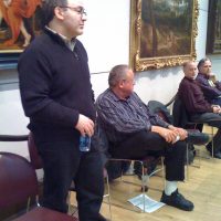 Mike listens with underwriter Alan Braun